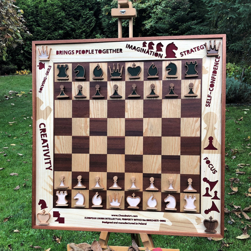 Creative and colorfull vertical chess set in autumn garden