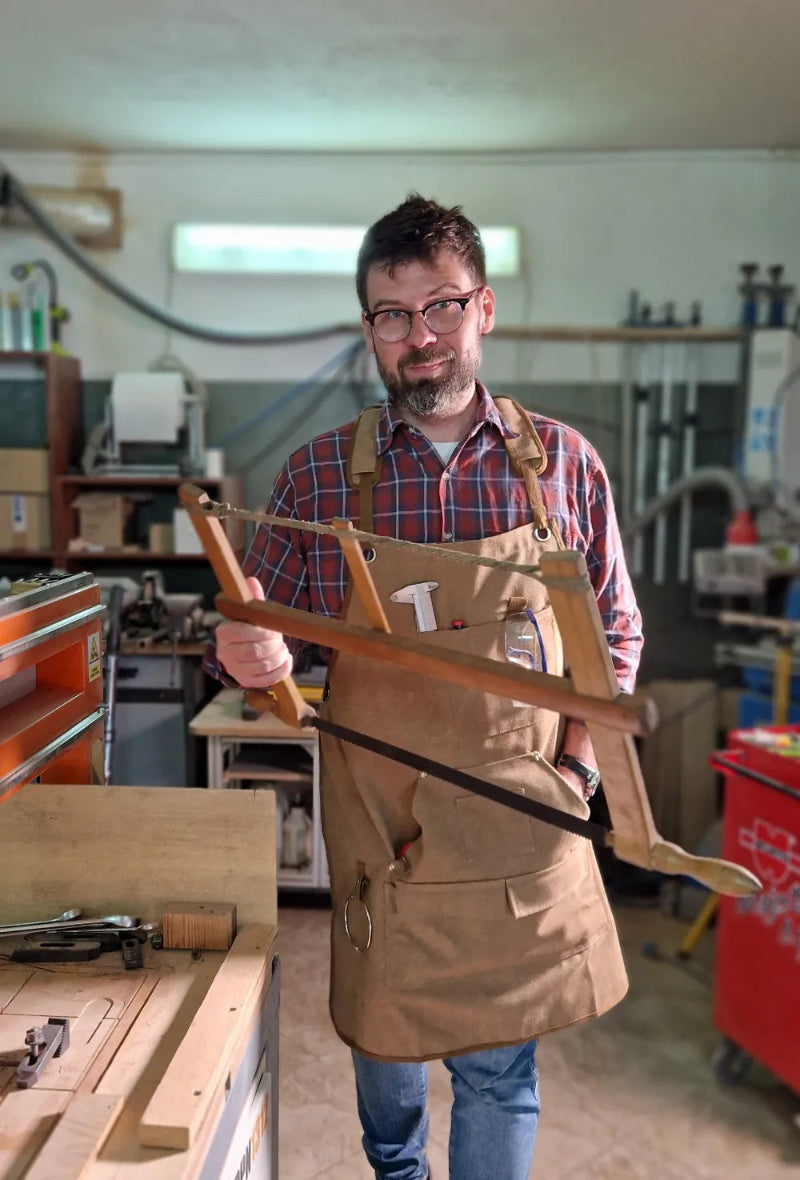 Michał Fudalej, at the ChessboArt workshop with his Great-Great-Grandfather's wood saw