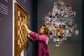 Chess Olympiad 2024 Budapest — Judit Polgar viewing the wall-mounted ChessboArt board